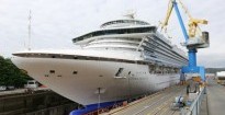 The 947-foot Crown Princess is one of the largest Princess cruise ships, with room for 3,080 guests.   Photograph By ADRIAN LAM, Times Colon