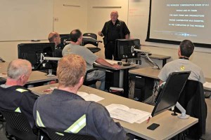 Instructor David Rogers from BC Hazmat Management Ltd. teaches a Workplace Hazardous Materials Information System (WHMIS) course to employee